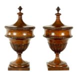 A FINE PAIR OF LATE 19TH CENTURY MAHOGANY LIDDED URNS