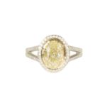 A LADIES 18CT WHITE GOLD 2.5CT FANCY LIGHT YELLOW OVAL SOLITAIRE DIAMOND RING