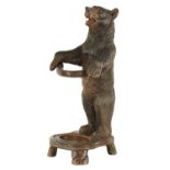 A LATE 19TH CENTURY CARVED BLACK FOREST BEAR STICK STAND