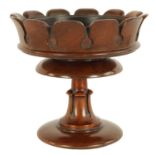 A LATE REGENCY MAHOGANY TREENWARE TABLE STAND