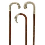 A SELECTION OF THREE ART NOVEAU FRENCH SILVER TOPPED WALKING STICKS