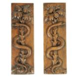 A PAIR OF 19TH CENTURY CARVED OAK HANGING PANELS