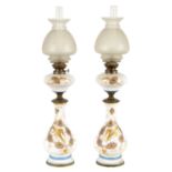 A PAIR OF FRENCH 19TH CENTURY OPALINE GLASS AND BRASS MOUNTED OIL LAMPS