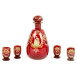 A 19TH CENTURY BOHEMIAN RUBY GLASS LIQUOR SET