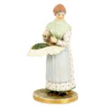 LATE 19TH CENTURY PORCELAIN FIGURE OF A STREET VENDOR - POSSIBLY RUSSIAN