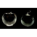 TWO CLEAR GLASS PAPERWEIGHTS ONE BY CARTIER AND THE OTHER BY TIFFANY & CO