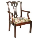 A CHIPPENDALE STYLE CARVED MAHOGANY CHILD'S OPEN ARMCHAIR