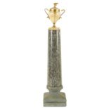 A 19TH CENTURY GRAND TOUR GRANITE AND ONYX URN TOPPED COLUMN