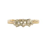 A LADIES 9CT YELLOW GOLD THREE STONE DIAMOND RING