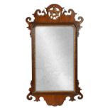 A GEORGE III MAHOGANY HANGING MIRROR