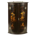 A GEORGE III BLACK LACQUER AND CHINOISERIE HANGING BOWFRONT CORNER CUPBOARD
