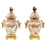 A PAIR OF 18TH CENTURY JAPANESE IMARI VASES AND COVERS WITH ORMOLU MOUNTS