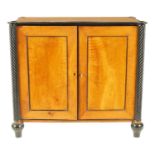 A GOOD EARLY 19TH CENTURY SATINWOOD AND EBONISED COLLECTOR'S CABINET