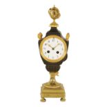 AN EARLY 19TH CENTURY FRENCH BRONZE AND ORMOLU MANTEL CLOCK