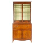 A GEORGE III MAHOGANY SECRETAIRE BOOKCASE IN THE MANNER OF GILLOWS