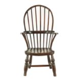 A 19TH CENTURY PRIMITIVE ELM AND FRUITWOOD STICK BACK CHILD’S WINDSOR CHAIR