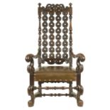 A 17TH CENTURY STYLE CONTINENTAL OAK ARMCHAIR OF GENEROUS SIZE