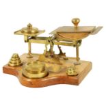 A SET OF LATE 19TH CENTURY BRASS PARCEL SCALES AND WEIGHTS