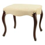 A 19TH CENTURY MAHOGANY FRAMED SERPENTINE SHAPED UPHOLSTERED DRESSING STOOL