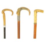 A SELECTION OF THREE HORN HANDLED WALKING STICKS