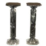 A PAIR OF 19TH CENTURY VEINED BLACK MARBLE REEDED COLUMNS