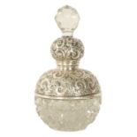 A GEORGE V SILVER TOPPED CUT GLASS PERFUME BOTTLE