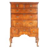 AN EARLY 18TH CENTURY FIGURED WALNUT CHEST ON STAND
