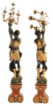 A PAIR OF 20TH CENTURY CARVED POLYCHROME BLACKAMOOR CARVED CANDELABRA