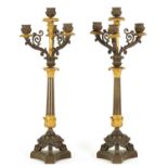 A PAIR OF REGENCY BRONZE AND ORMOLU THREE BRANCH CANDELABRA