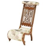 A 19TH CENTURY FIGURED ROSEWOOD PRAYER CHAIR