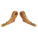 A PAIR OF LATE 19TH CENTURY WALNUT CURTAIN POLE BRACKETS