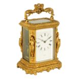 HENRY MARC, PARIS. A MID 19TH CENTURY GILT BRASS FIGURAL CARRIAGE CLOCK