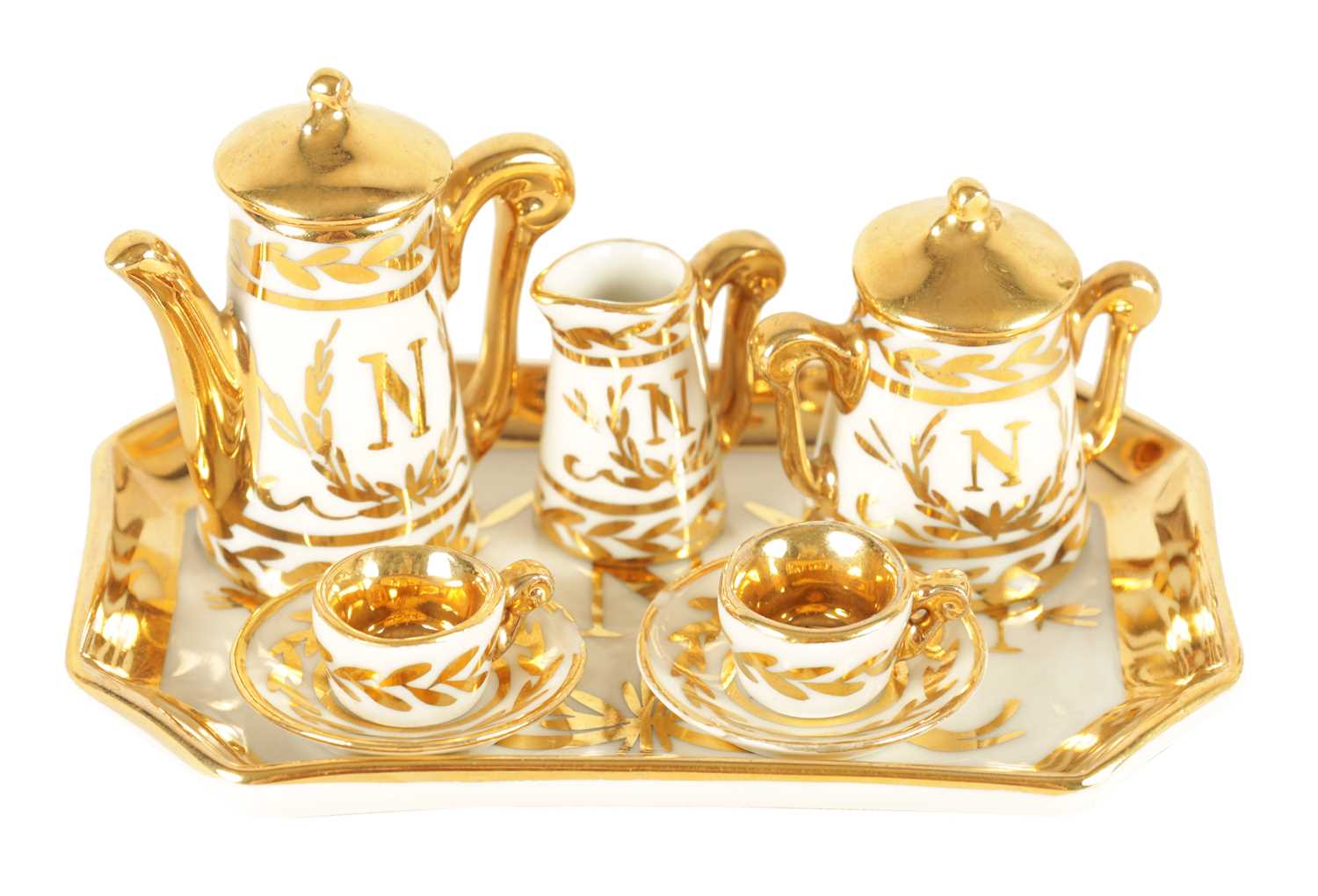 AN EARLY 20TH CENTURY MINIATURE LIMOGES PORCELAIN FRENCH NAPOLEON TEA SERVICE