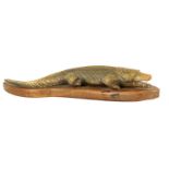 A LATE 19TH CENTURY CARVED HORN CROCODILE SCULPTURE