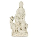 AN 18TH CENTURY CHINESE BLANC DE CHINE PORCELAIN OF GUANYIN