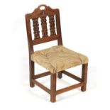 AN UNUSUAL GEORGE III OAK SIDE CHAIR OF SMALL SIZE