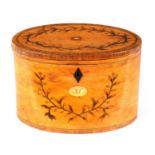 A GEORGE III INLAID SATINWOOD OVAL SHAPED TEA CADDY