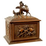 A 19TH CENTURY CARVED BLACK FOREST CIGAR BOX