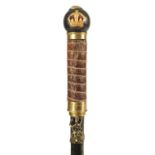 AN EARLY 20TH CENTURY EBONISED AND LEATHER MOUNTED SWORD STICK