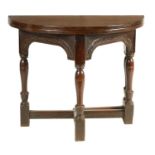 A 17TH CENTURY JOINED OAK CREDENCE TABLE