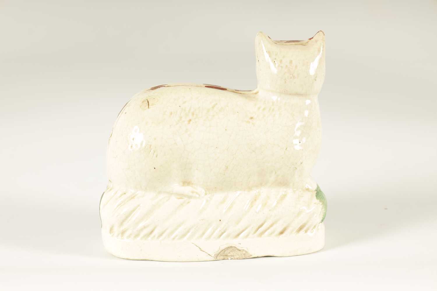 AN EARLY 19TH CENTURY STAFFORDSHIRE MODEL ON A RECUMBENT CAT - Image 5 of 8