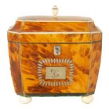 A REGENCY TORTOISESHELL AND IVORY BANDED SARCOPHAGUS TEA CADDY