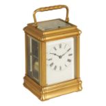 A LATE 19TH CENTURY FRENCH GILT BRASS GORGE-CASED REPEATING CARRIAGE CLOCK
