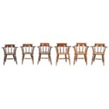 A GOOD MATCHED SET OF SIX MID 19TH CENTURY YEW-WOOD SMOKERS' BOW ARMCHAIRS