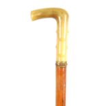 A LATE 19TH CENTURY RHINOCEROS HORN HANDLED SWORD STICK