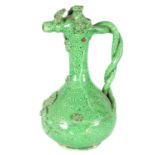 AN OTTOMAN REVIVAL TURKISH GREEN GLAZED TERRACOTTA CANAKKALE EWER