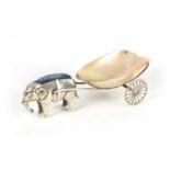 A RARE EDWARD VII SILVER PIN CUSHION IN THE FORM OF AN ELEPHANT PULLING A MOTHER OF PEARL CART