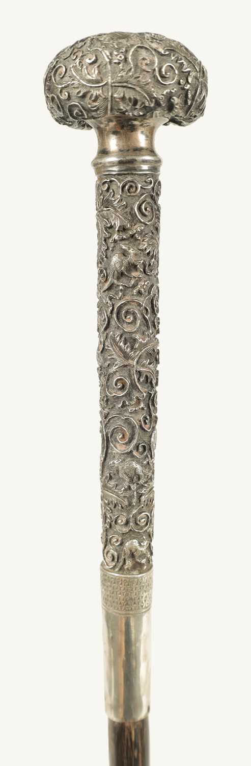 A LATE 19TH CENTURY CHINESE SILVER MOUNTED RHINOCEROS HORN WALKING CANE