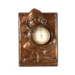 AN ARTS AND CRAFTS COPPER NOVELTY DESK BAROMETER DEPICTING A FIREMAN