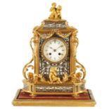 A LATE 19TH CENTURY FRENCH GLAZED ORMOLU MANTEL CLOCK